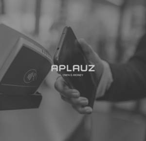 The Aplauz logo on top of an image of a person using their phone to pay on a contactless portal.
