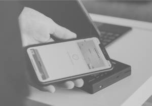 person using apple pay on their mobile phone