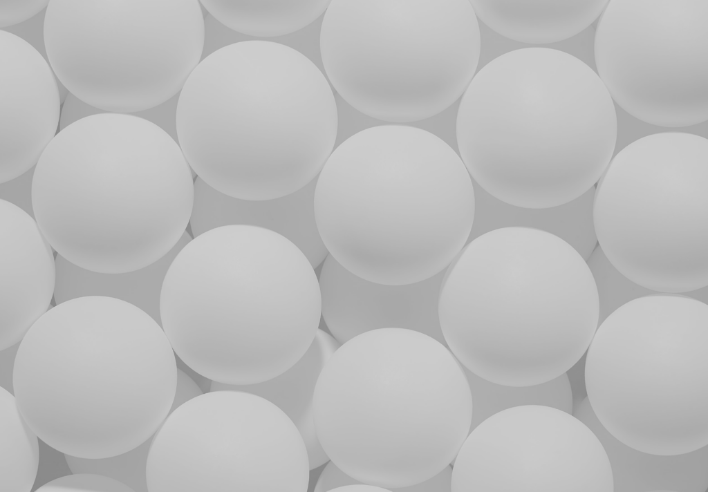 Multiple white balls on top of each other.